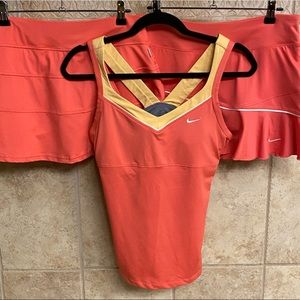 Nike tennis top with 2 matching skirts, salmon/orange colored, size medium
